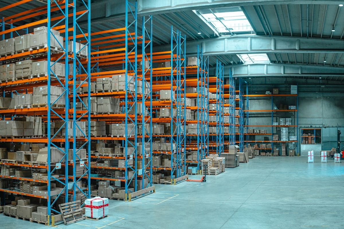 High-bay warehouse racking filled with boxed electronics